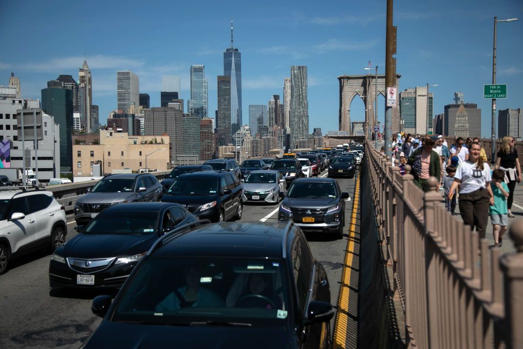 Traffic and tourists on the Brooklyn Bridge in New York, US, on Friday, May 24, 2024. New York City will see a record influx of travelers this Memorial Day weekend, with a crush at the region's three major airports in particular creating traffic and parking problems. Photographer: Michael Nagle/Bloomberg