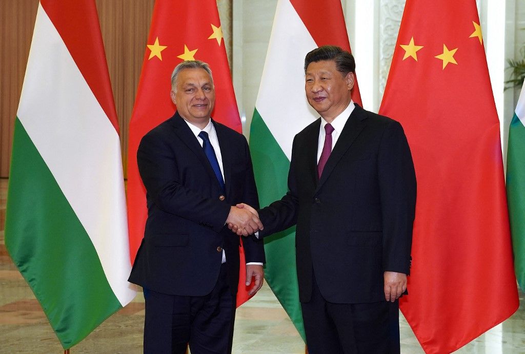 (FILES) Hungarian Prime Minister Viktor Orban (L) shakes hands with Chinese President Xi Jinping during a meeting on April 25, 2019, as part of the second Belt and Road Forum (BRF) in Beijing. As one of China's closest allies in Europe, Hungary will seek to strengthen its ties with the Asian power, when President Xi Jinping wraps up his European tour in Budapest from May 8, 2024. (Photo by Andrea VERDELLI / POOL / AFP)
