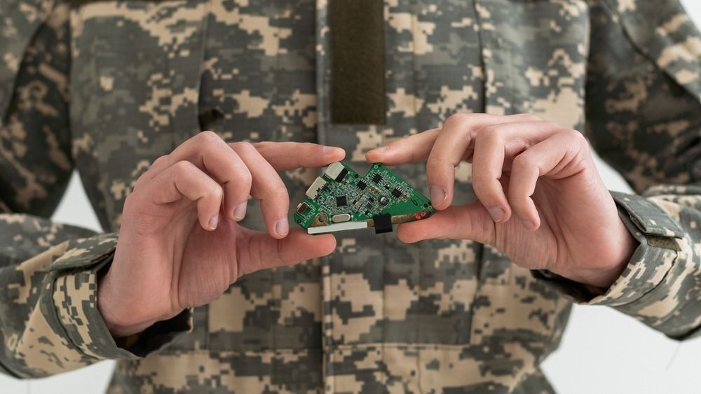 A,Military,Man,Is,Holding,A,Chip,Electronic,Components.,Industry.