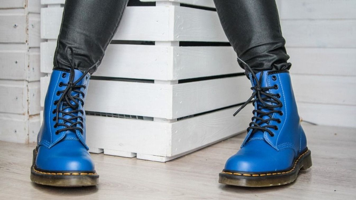 Woman tries on her new pair of Dr. Martens 1460 Air Wair blue leather boots in Oslonino, Poland on 25 April 2020  (Photo by Michal Fludra/NurPhoto) (Photo by Michal Fludra / NurPhoto / NurPhoto via AFP)