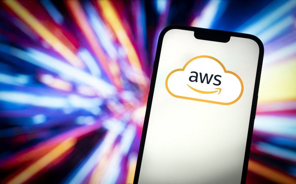 The Amazon Web Services cloud logo is seen in this photo illustration on 23 November, 2023 in Warsaw, Poland. (Photo by Jaap Arriens/NurPhoto) (Photo by Jaap Arriens / NurPhoto / NurPhoto via AFP)
