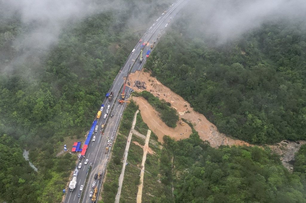 This photo taken on May 1, 2024 shows an aerial view of a collapsed section of a highway near Meizhou, in southern China’s Guangdong province. At least 36 people died after part of a highway collapsed due to heavy rain on May 1, state media said. (Photo by CNS / CNS / AFP) / China OUT