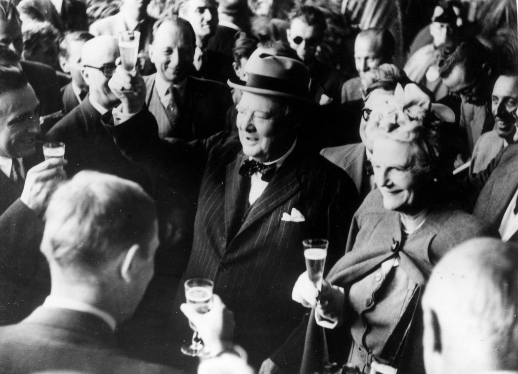 The Churchills26th August 1946:  Former British prime minister Winston Leonard Spencer Churchill (1874 - 1965) and his wife Clementine make a toast upon their arrival in Switzerland.  (Photo by Keystone/Getty Images)