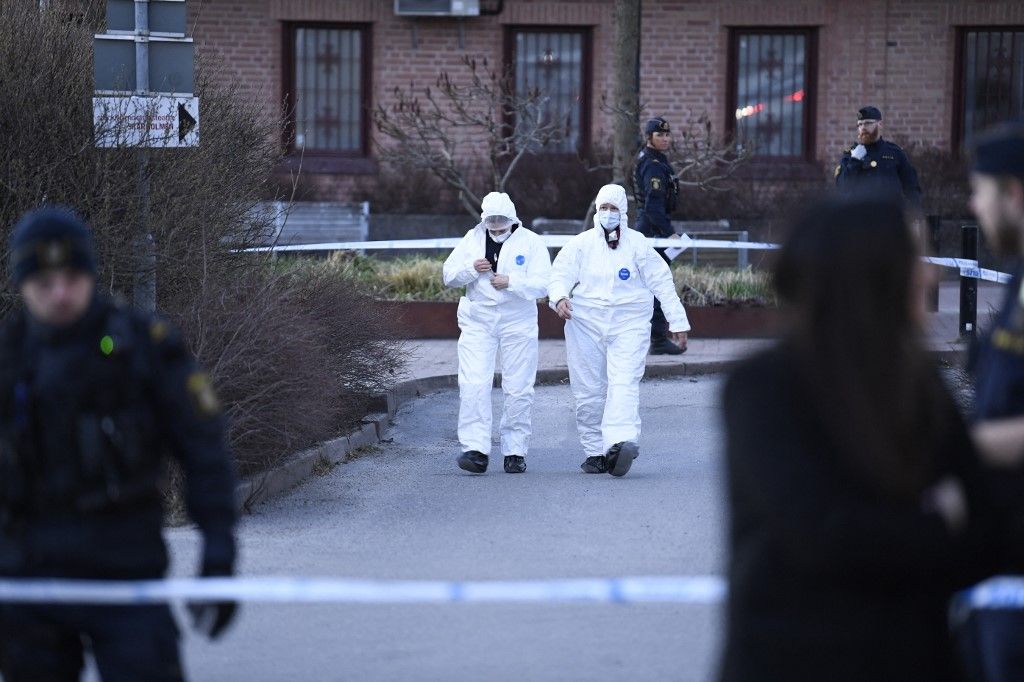 SHOOTING SWEDEN
Police and police technicians on the scene after a person was shot and died at Skärholmen in southern Stockholm, Sweden in the evening April 10, 2024.
Photo: Oscar Olsson / TT / Code 12046 (Photo by Oscar Olsson / TT NEWS AGENCY / TT News Agency via AFP)