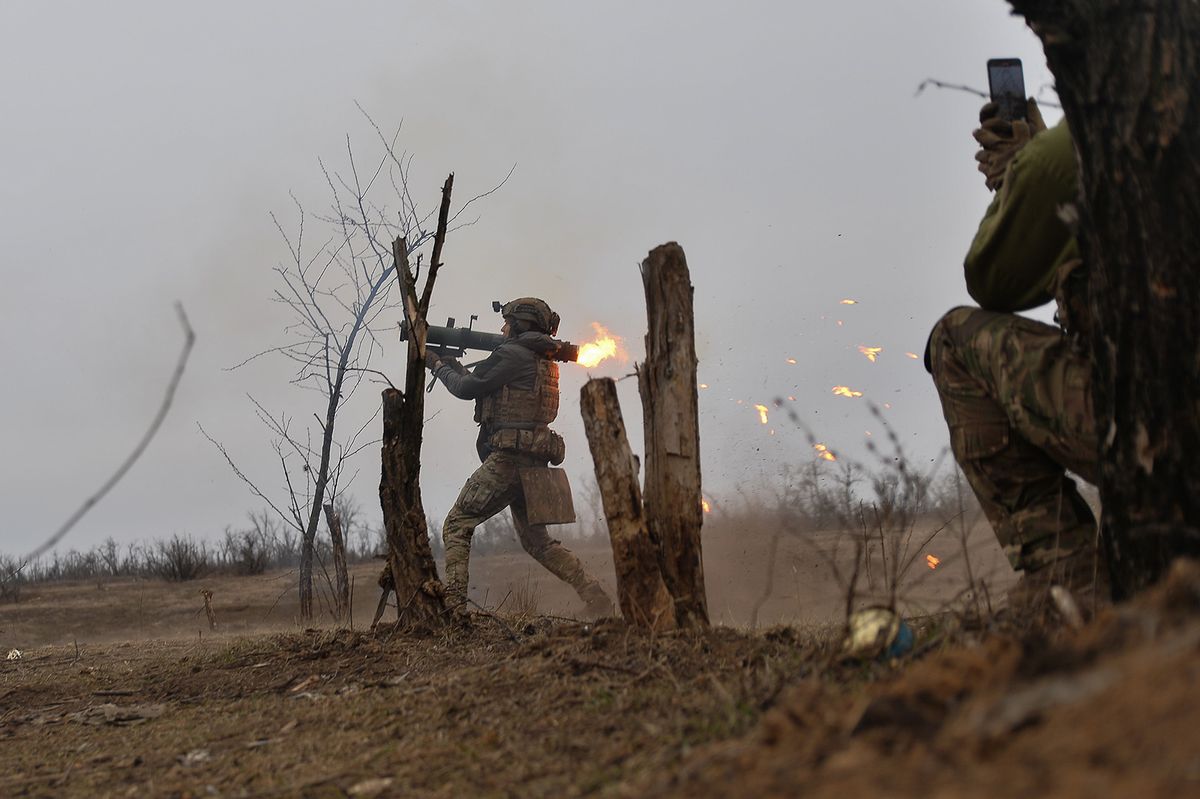 March 7, 2024, Bakhmut, Donetsk Oblast, Ukraine: ZHENYA, a Ukrainian soldier, fires a hornet system RPG toward Russian troops dug in at the frontlines. The Russian positions are only 100m away from Ukrainian troops. Two years into Russia's full-scale war against Ukraine, a Carnegie-sponsored opinion poll found that Ukrainians still believe strongly in their national cause, even as doubts creep in about the path to victory. Ukrainians remain committed to the war effort, are opposed to capitulating to Russian demands, and are far from clamoring for a change in leadership. Still, their expectations for victory remain high as ninety states from around the globe have signed up to attend a June 15, conference aimed at finding a route to sustainable peace in Ukraine and ending the war that started nearly 28 months ago. Welcome to 'War and Peace: Ukraine's Impossible Choices'