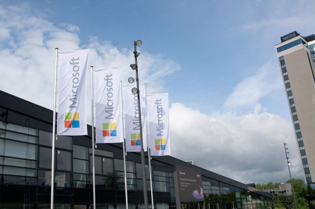 Microsoft flags are being seen in front of the World Conference Center during the Microsoft AI training roadshow in Bonn, Germany, on May 22, 2024. (Photo by Ying Tang/NurPhoto) (Photo by Ying Tang / NurPhoto / NurPhoto via AFP)