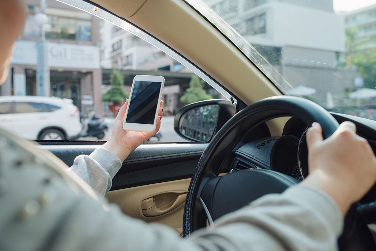 woman sit in modern car in front of dashboard