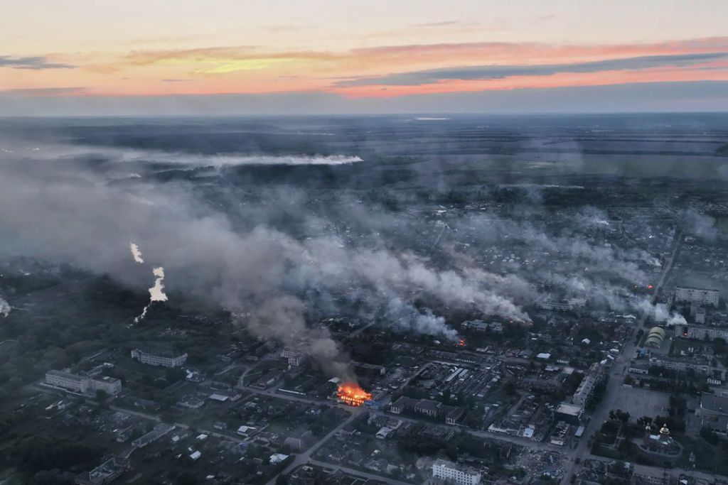VOVCHANSK, UKRAINE - MAY 17: In this screengrab taken from aerial video footage smoke rises from the Ukranian boarder city of Vovchansk, in Chuhuiv Raion, Kharkiv Oblast, which is bombarded daily by heavy artillery on May 17, 2024 in Vovchansk, Ukraine. Ukraine has been evacuating civilians from around Vovchansk as Russian forces advance in the area.  (Photo by Libkos/Getty Images)