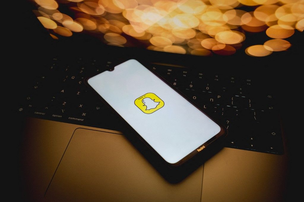 The SnapChat logo is being displayed on a smartphone screen in Athens, Greece, on May 31, 2024. (Photo by Nikolas Kokovlis/NurPhoto) (Photo by Nikolas Kokovlis / NurPhoto / NurPhoto via AFP)
Snapchat