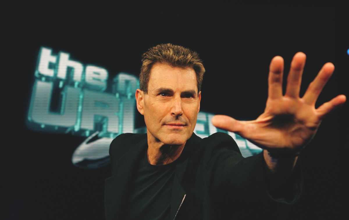 Israeli psychic Uri Geller poses for photographers in Cologne