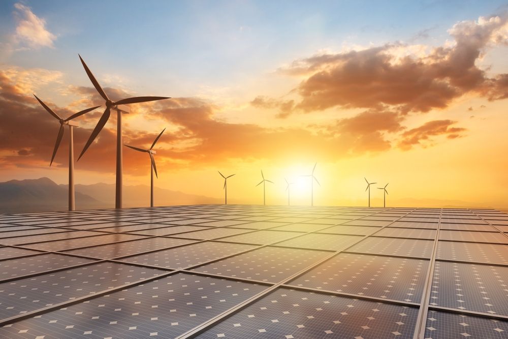 Solar,Panel,And,Wind,Turbine,Against,A,Beautiful,Sunset,Sky