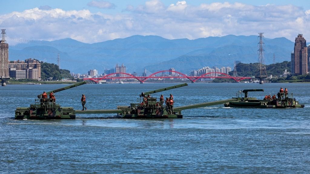 NEW TAIPEI, TAIWAN - JULY 22: Soldiers on board an amphibious ferrying vehicle take part in a river defense exercise as part of the annual Han Kuang military drill, at Tamsui River in New Taipei, Taiwan on July 22, 2024. The Han Kuang drill comes as China’s People’s Liberation Army (PLA) has increased their presence in and around the Taiwan Strait by sending fighter jets and vessels, amid continued tensions between Beijing and the United States over self-governing Taiwan. Daniel Ceng / Anadolu (Photo by Daniel Ceng / ANADOLU / Anadolu via AFP)