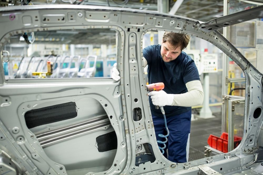 Man,Working,In,Modern,Car,Factory