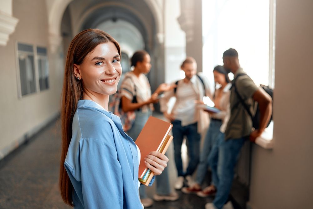 A,Confident,Student,Is,Depicted,In,A,Busy,University,Hallway,