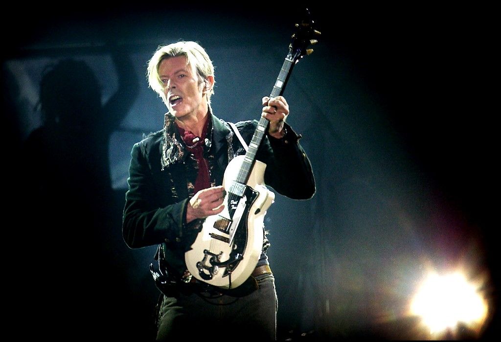 DAVID BOWIE
Rock legend David Bowie performs on stage at the Forum in Copenhagen late 07 October 2003. (Photo by NILS MEILVANG / Ritzau Scanpix / AFP)