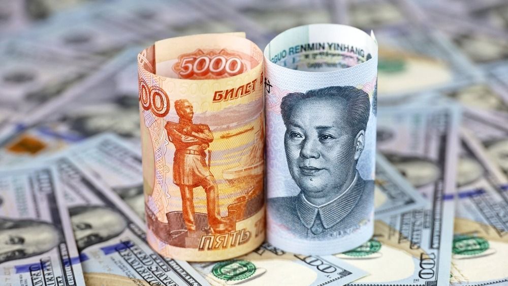 Chinese,Yuan,Banknote,And,Russian,Ruble,Rolled,Up,On,Us