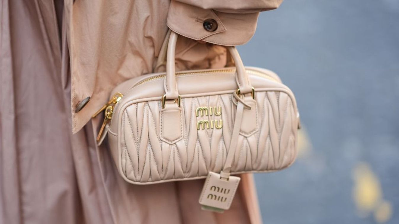 PARIS, FRANCE - JUNE 25: A guest wears a light brown leather Miu Miu bag, outside Stephane Rolland, during the Paris Haute Couture Week Fall/Winter 2024-2025 on June 25, 2024 in Paris, France. (Photo by Edward Berthelot/Getty Images)