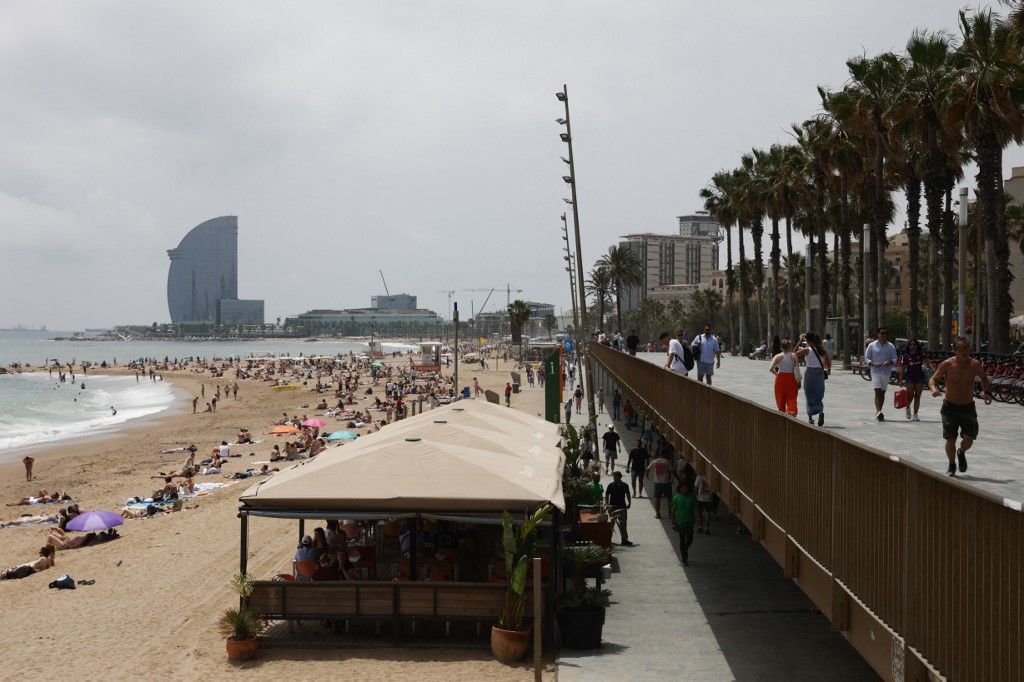 A view of the Barceloneta Beach and the promenade in Barcelona, Spain on June 19, 2024. (Photo by Jakub Porzycki/NurPhoto) (Photo by Jakub Porzycki / NurPhoto / NurPhoto via AFP)