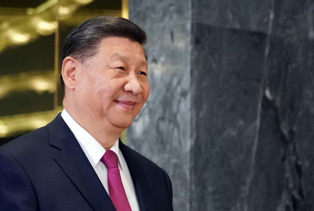 In this pool photograph distributed by the Russian state agency Sputnik, China's President Xi Jinping arrives to meet his Russian counterpart on the sidelines of the Shanghai Cooperation Organisation (SCO) member states leaders' summit in Astana on July 3, 2024. (Photo by Pavel Volkov / POOL / AFP)