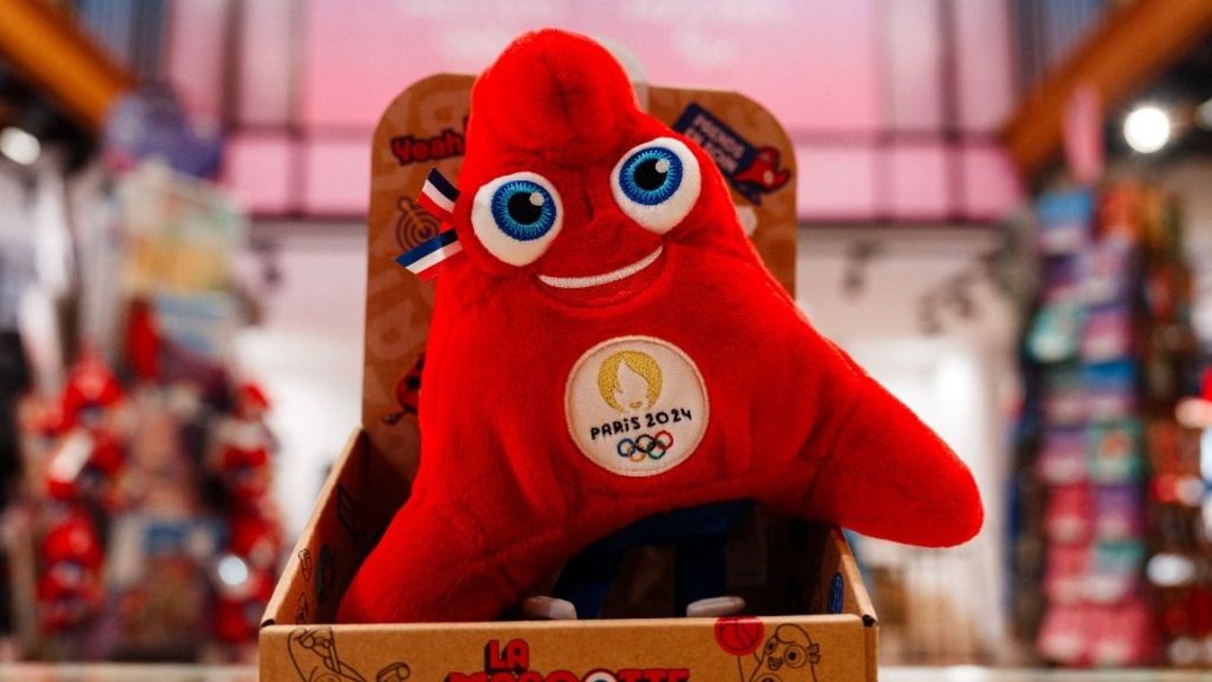 An official Olympic Phryge mascot for the Paris 2024 Summer Olympic and Paralympic Games are displayed in the official store in Paris on December 15, 2023. (Photo by Dimitar DILKOFF / AFP)