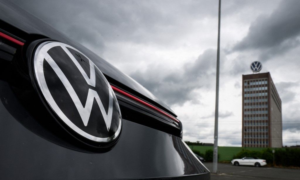 29 May 2024, Lower Saxony, Wolfsburg: A VW Golf GTI stands in a parking lot within sight of the brand tower on the grounds of the VW plant in Wolfsburg. Volkswagen AG invites its shareholders to the Annual General Meeting. Photo: Julian Stratenschulte/dpa (Photo by JULIAN STRATENSCHULTE / DPA / dpa Picture-Alliance via AFP)