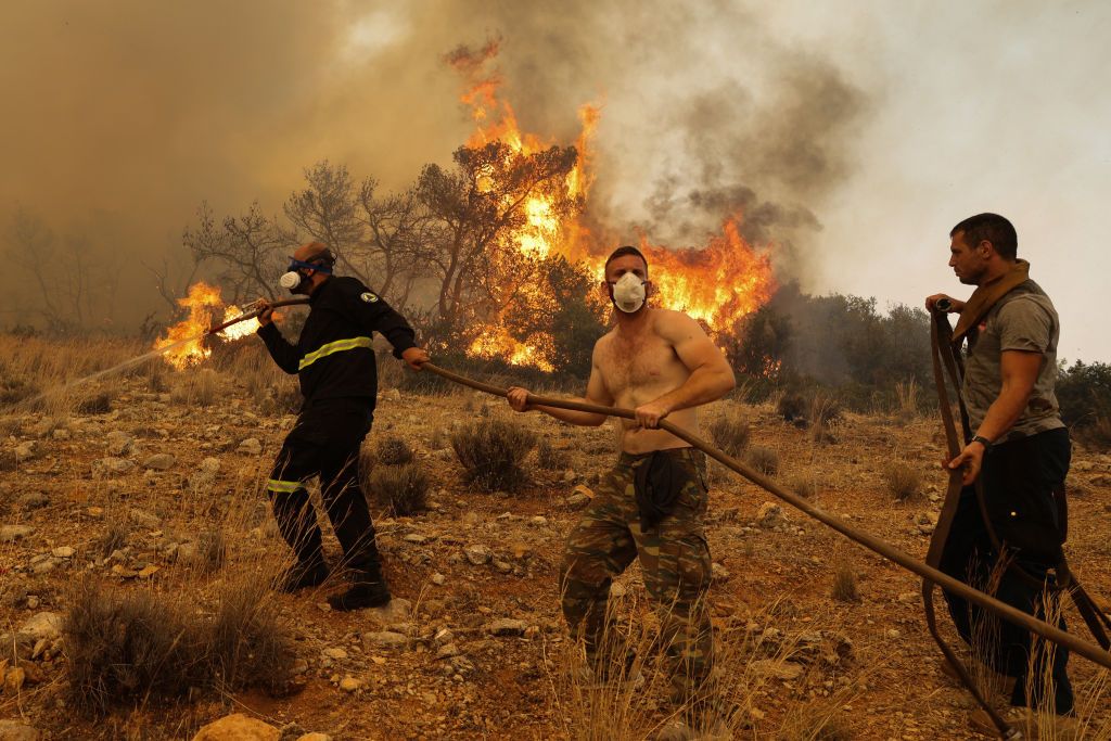 ATHENS, GREECE - JULY 19: Firefighter teams intervene a wildfire at the village of Ano Vlichada, near Athens, Greece on July 19, 2023. (Photo by Costas Baltas/Anadolu Agency via Getty Images)