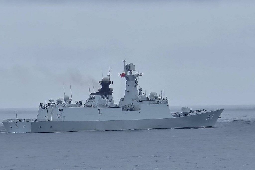 This handout photo taken and released by the Taiwan Coast Guard on May 23, 2024 shows a Chinese military ship northwest of Pengjia Island, off the coast of northern Taiwan. China on May 23 encircled Taiwan with naval vessels and military aircraft in war games aimed at punishing the self-ruled island after its new president vowed to defend democracy. (Photo by Handout / TAIWAN COAST GUARD / AFP) / -----EDITORS NOTE --- RESTRICTED TO EDITORIAL USE - MANDATORY CREDIT "AFP PHOTO / TAIWAN COAST GUARD " - NO MARKETING - NO ADVERTISING CAMPAIGNS - DISTRIBUTED AS A SERVICE TO CLIENTS