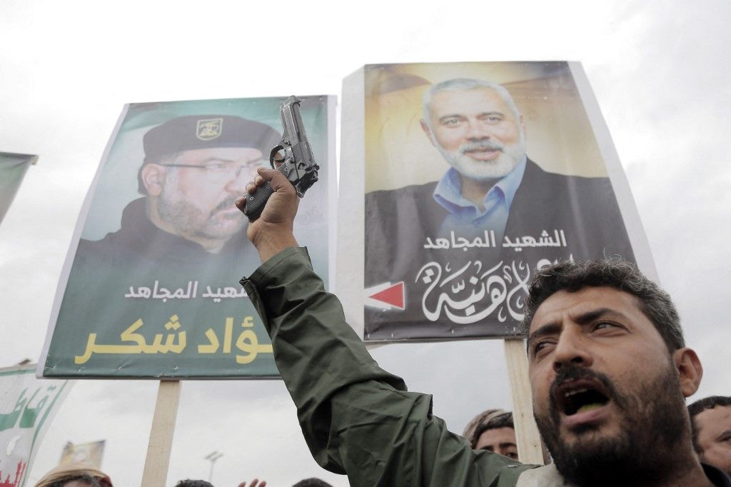 SANAA, YEMEN - AUGUST 2: Thousands of people protest the assassination of Hamas Political Bureau Chief Ismail Haniyeh in Iran, and Israel's attacks on the Gaza Strip in Yemen's capital, Sana'a on August 02, 2024. The demonstrators carried posters with the photos of Hamas' Political Bureau Chairman Haniyeh and senior Hezbollah commander Shukr. Mohammed Hamoud / Anadolu (Photo by Mohammed Hamoud / ANADOLU / Anadolu via AFP)