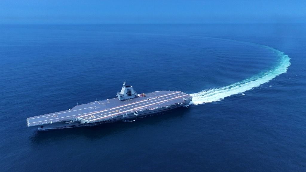 (240508) -- SHANGHAI, May 8, 2024 (Xinhua) -- An aerial drone photo taken on May 7, 2024 shows China's third aircraft carrier, the Fujian, during its maiden sea trials. China's third aircraft carrier, the Fujian, completed maiden sea trials on Wednesday. (Photo by Ding Ziyu/Xinhua) (Photo by Liu Fang / XINHUA / Xinhua via AFP)