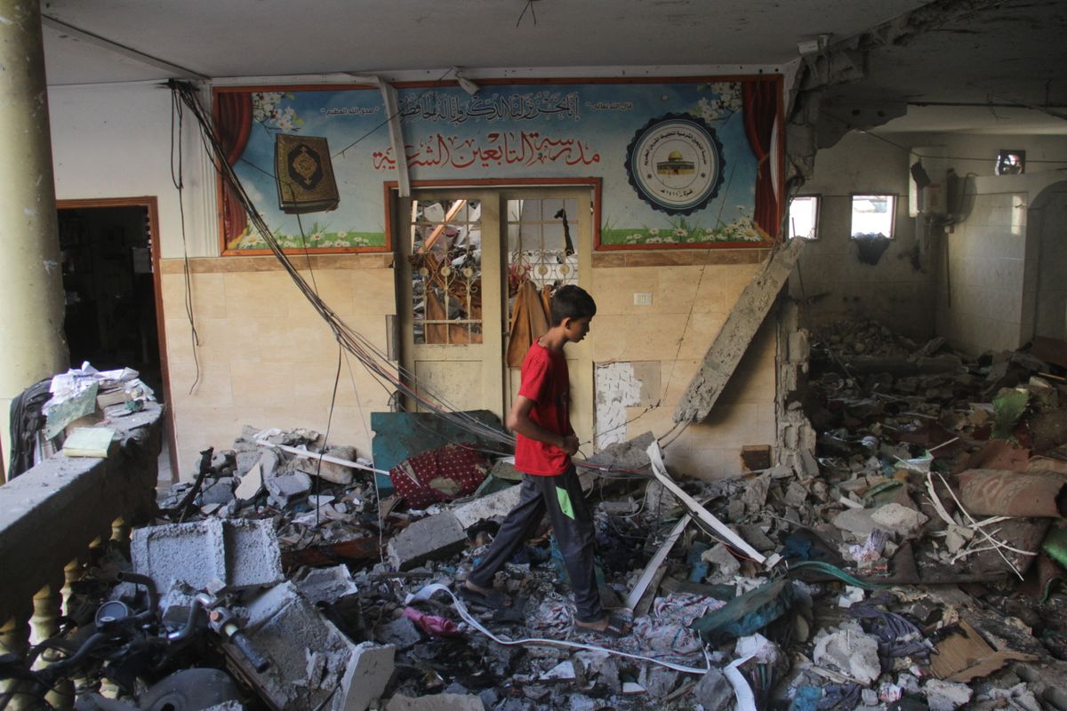 Israeli military kills at least 100 Palestinians in Gaza school bombing