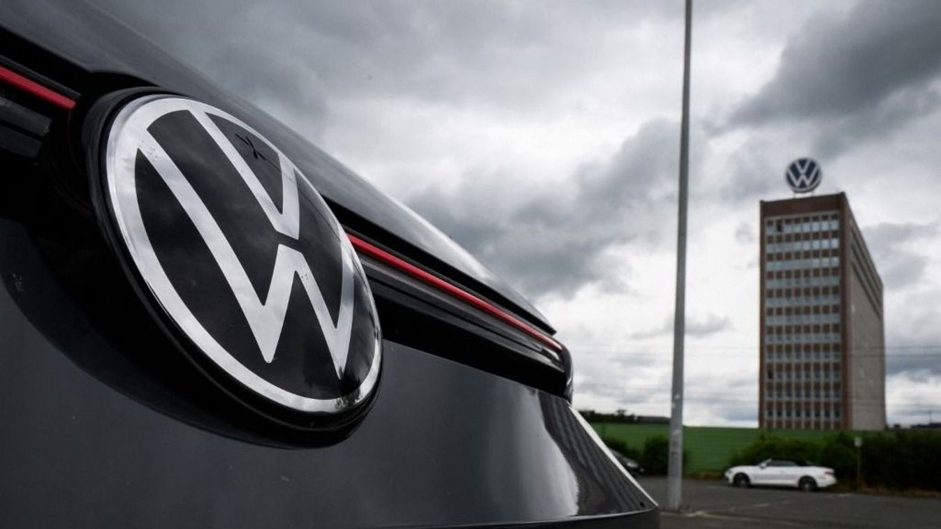 29 May 2024, Lower Saxony, Wolfsburg: A VW Golf GTI stands in a parking lot within sight of the brand tower on the grounds of the VW plant in Wolfsburg. Volkswagen AG invites its shareholders to the Annual General Meeting. Photo: Julian Stratenschulte/dpa (Photo by JULIAN STRATENSCHULTE / DPA / dpa Picture-Alliance via AFP)