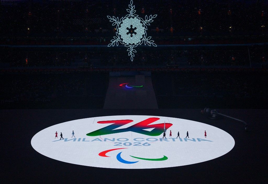 This handout photo taken and received from the OIS/IOC on March 13, 2022 shows the Milan-Cortina 2026 Winter Games logo after the flag handover ceremony during the closing ceremony of the Beijing 2022 Winter Paralympic Games, at the National Stadium, known as the Bird's Nest, in Beijing. (Photo by Bob MARTIN / OIS/IOC / AFP) / RESTRICTED TO EDITORIAL USE - MANDATORY CREDIT "AFP PHOTO / OIS/IOC " - NO MARKETING - NO ADVERTISING CAMPAIGNS - DISTRIBUTED AS A SERVICE TO CLIENTS