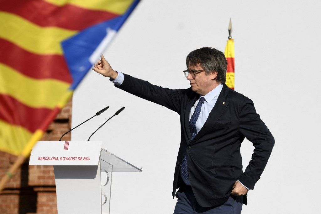 BARCELONA, SPAIN - AUGUST 08: Former Catalan President Carles Puigdemont makes his first public appearance since he fled Spain in 2017, speaking at a public rally in Barcelona, Spain on August 08, 2024. Since leading the failed 2017 independence push for Catalonia to break away from Spain, he has been wanted by the Spanish justice system. Catalan police had the order to arrest him immediately, but Puigdemont managed to speak for several minutes outside of the Catalan parliament. After the rally, he disappeared. Adria Puig / Anadolu (Photo by Adria Puig / ANADOLU / Anadolu via AFP)