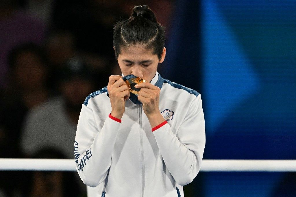 Gold medallist Taiwan's Lin Yu-ting celebrates on the podium during the medal ceremony for the women's 57kg final boxing category during the Paris 2024 Olympic Games at the Roland-Garros Stadium, in Paris on August 10, 2024. (Photo by MOHD RASFAN / AFP)
Imane Helif