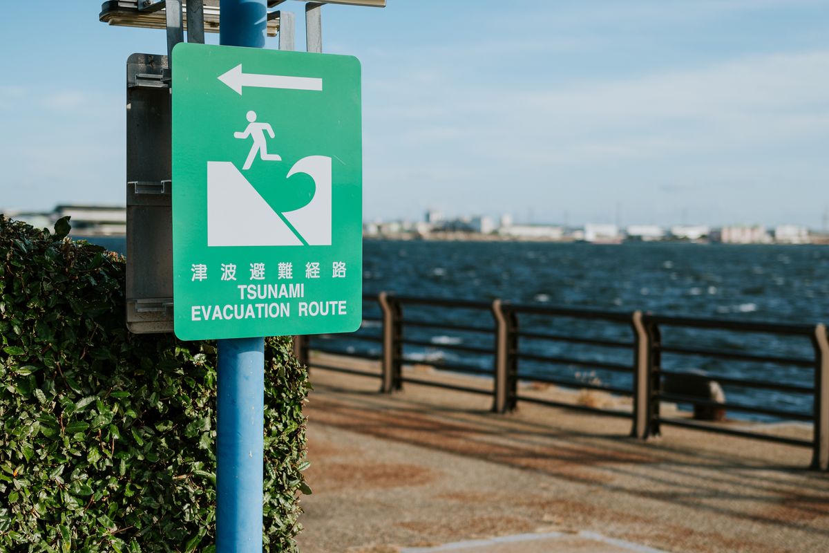 Close up of tsunami evacuation route sign, cunami