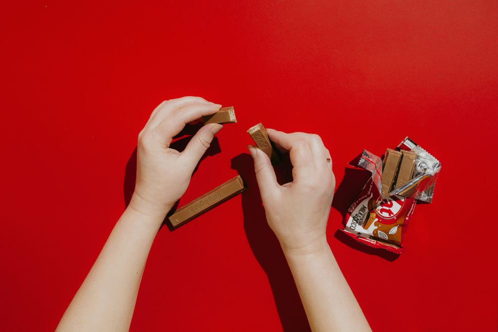 Kiev,,Ukraine,-,December,10,,2019:,Hands,Holding,Kikat,Chocolate