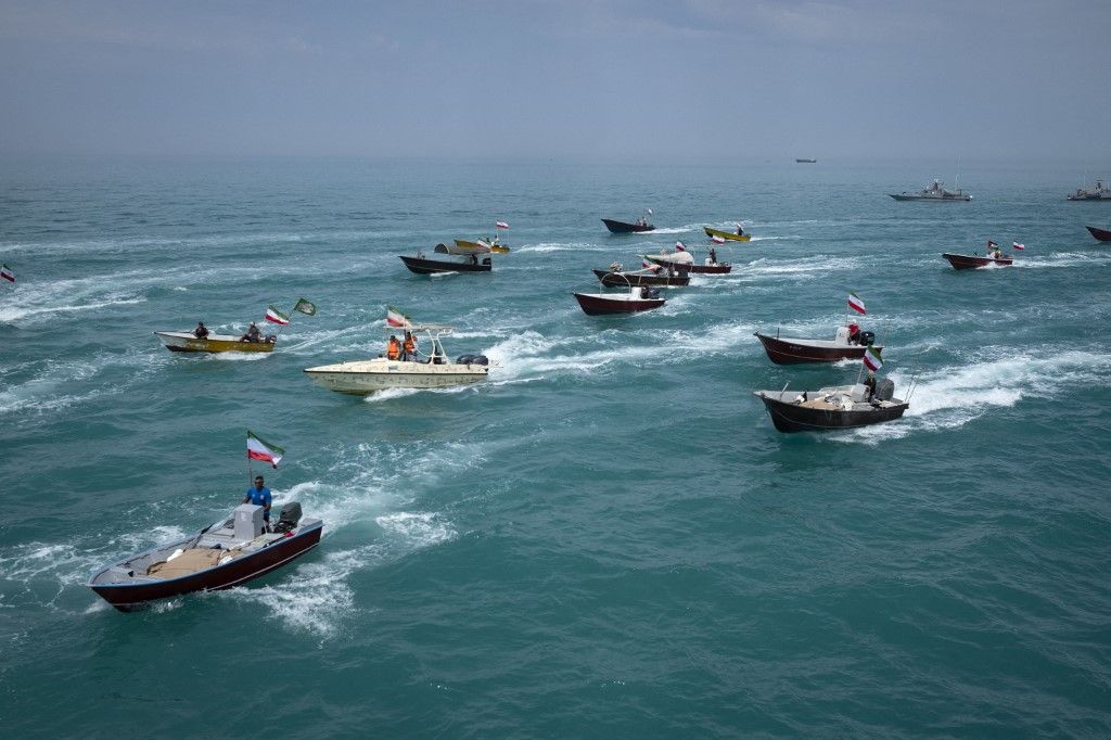 Basij paramilitary force speed boats are sailing along the Persian Gulf during the Islamic Revolutionary Guard Corps (IRGC) marine parade to commemorate Persian Gulf National Day, near the Bushehr nuclear power plant in the seaport city of Bushehr, Bushehr province, in the south of Iran, on April 29, 2024. Persian Gulf National Day, which celebrates the expulsion of the Portuguese from the Strait of Hormuz and the Persian Gulf in 1622 by the Safavid forces led by Imam Quli Khan under the command of Shah Abbas I, is observed on the 10th of Ordibehesht in the Iranian calendar, typically falling in late April or early May. (Photo by Morteza Nikoubazl/NurPhoto) (Photo by Morteza Nikoubazl / NurPhoto / NurPhoto via AFP)