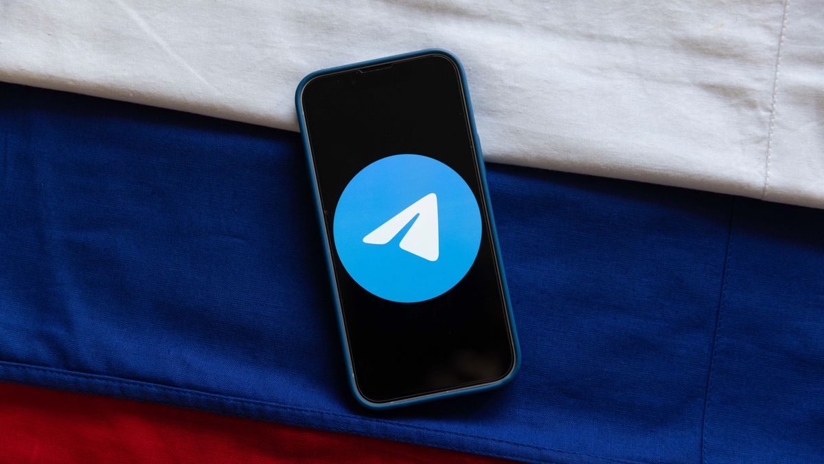 Telegram Messenger App logo with Russian flag.