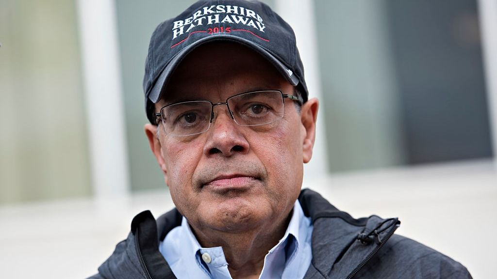 Ajit Jain, head of the Berkshire Hathaway reinsurance business, stands during the "Berkshire Hathaway Invest In Yourself 5K" race presented by Brooks Sports, Inc., a Berkshire company, on the sidelines of the Berkshire Hathaway Inc. annual shareholders meeting in Omaha, Nebraska, U.S., on Sunday, May 3, 2015. More than 40,000 people were expected to attend yesterday's Berkshire Hathaway annual meeting, which marks Warren Buffett's 50th year running the company. Photographer: Daniel Acker/Bloomberg via Getty Images 