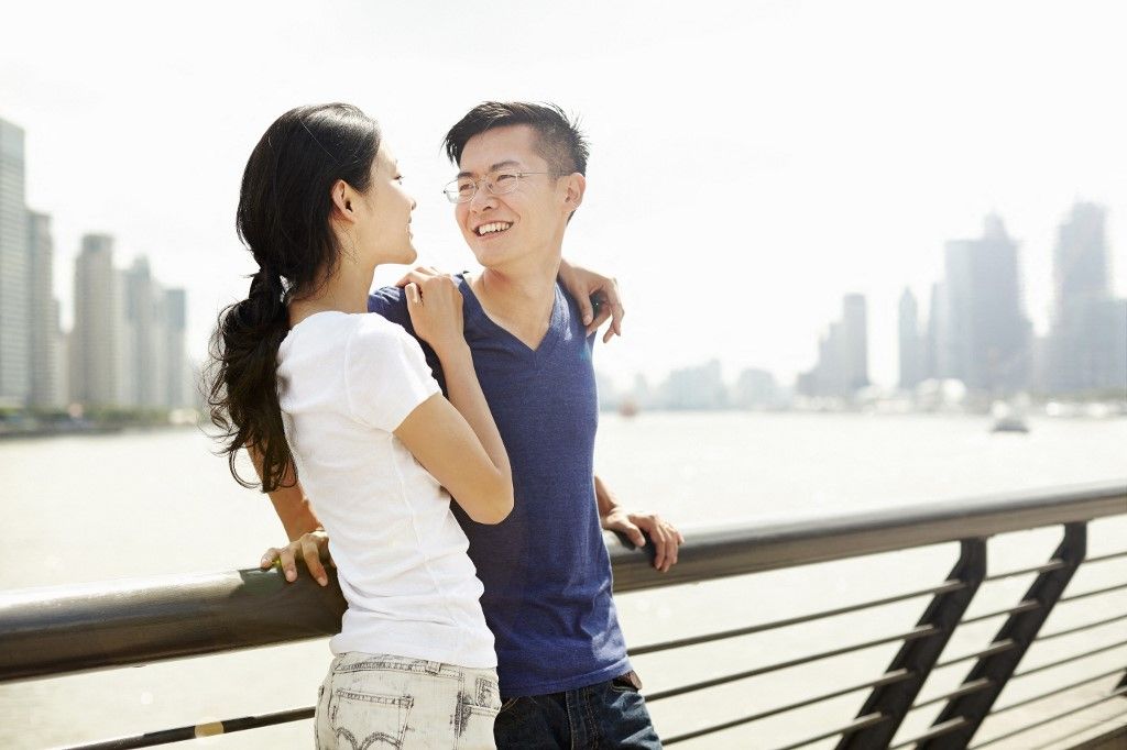 Smiling tourist couple on bridge, The Bund, Shanghai, China (Photo by Philippe Roy / Connect Images / Connect Images via AFP)