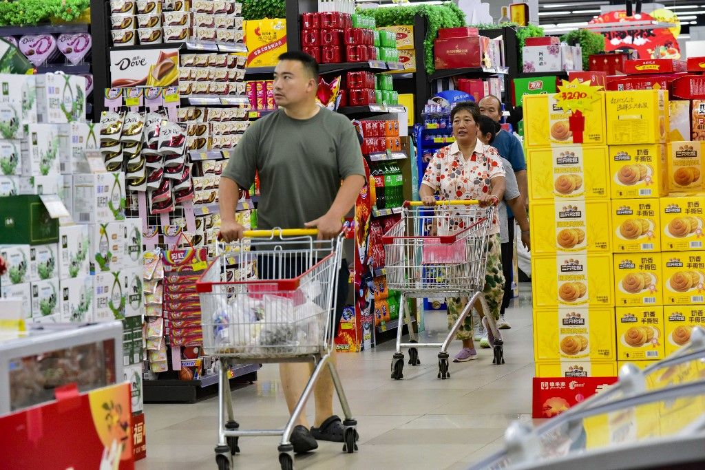 Consumers shop at a supermarket in Qingzhou, China, on September 9, 2024. On September 14, 2024, the National Bureau of Statistics releases data showing that in August 2024, the total retail sales of social consumer goods in China is 3,872.6 billion yuan, an increase of 2.1%. From January to August, the total retail sales of consumer goods reach 3,245.2 trillion yuan, up by 3.4% year-on-year. (Photo by Costfoto/NurPhoto) (Photo by CFOTO / NurPhoto / NurPhoto via AFP)