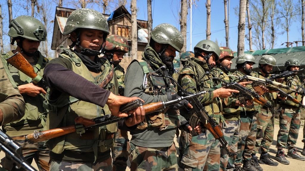 Indian Army Soldiers In Kashmir
Indian army soldiers load their weapons before CASO Cordon And Search Operation drill in South Kashmir's Kulgam District, Jammu and Kashmir, India on 28 March 2022. (Photo by Nasir Kachroo/NurPhoto) (Photo by Nasir Kachroo / NurPhoto / NurPhoto via AFP)