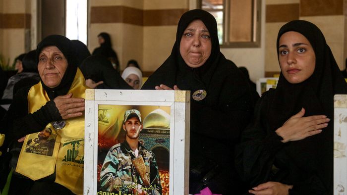 Raising The StakesSeptember 7, 2024, Beirut, Lebanon: Women beat on their chests as a sign of mourning as they visit the graves of their beloved ones, dead fighter of pro-Iranian Hezbollah that were killed in fighting against Israel, during a ceremony to mark the 40th day of the assassination of the party top commander Fouad Shukur at a grave yard dedicated for Hezbollah militants. (Credit Image: © Marwan Naamani/ZUMA Press Wire)