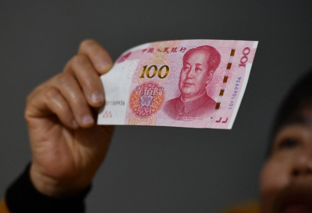 A citizen is counting Chinese Yuan in Fuyang, Anhui province, China, on February 20, 2024. On the same day, the People's Bank of China authorized the National Interbank Lending Center to announce that the Loan Prime Rate (LPR) for 1 year is 3.45%, and the LPR for more than 5 years is 3.95%. The former remains unchanged from the previous period, while the latter has decreased by 25 basis points from the previous period. (Photo by Costfoto/NurPhoto) (Photo by CFOTO / NurPhoto / NurPhoto via AFP)