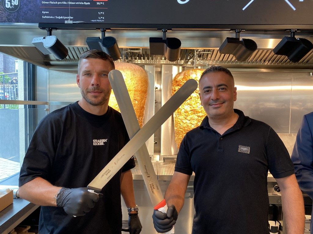 German footballer Lukas Podolski opens the 11th branch of his chain Doner Kebab restaurant in Cologne
robot kebabos