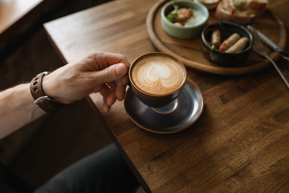 A,Close-up,Shot,Of,A,Cappuccino,Cup,With,A,Heart-shaped