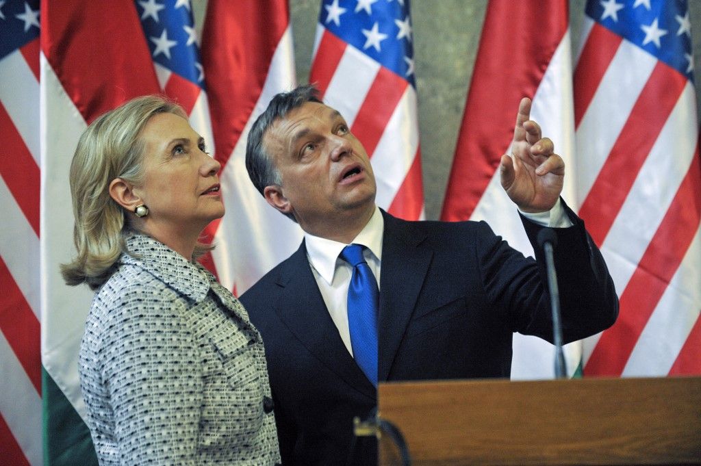 U.S. Secretary of State Hillary Rodham Clinton (L) listens to Hungarian Prime Minister Viktor Orban (R) after their joint press conference in Delegation Hall  of the parliament building on June 30, 2011. The American guest pays a visit here and Lithuania as part of a tour focused on promoting human rights and democracy.  AFP PHOTO / ATTILA KISBENEDEK (Photo by ATTILA KISBENEDEK / AFP) Orbán Viktor