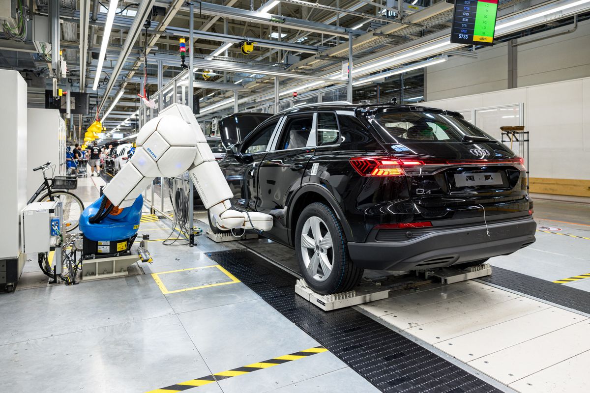 An electric car of the Audi brand is manufactured at the production plant of the German car manufacturer Volkswagen in Zwickau, eastern Germany, on August 20, 2024. In Zwickau, the automotive cradle of the former GDR, multiple crises are fuelling the influence of the extreme right, as is the case almost everywhere in Saxony before the regional elections on September 1. (Photo by JENS SCHLUETER / AFP)