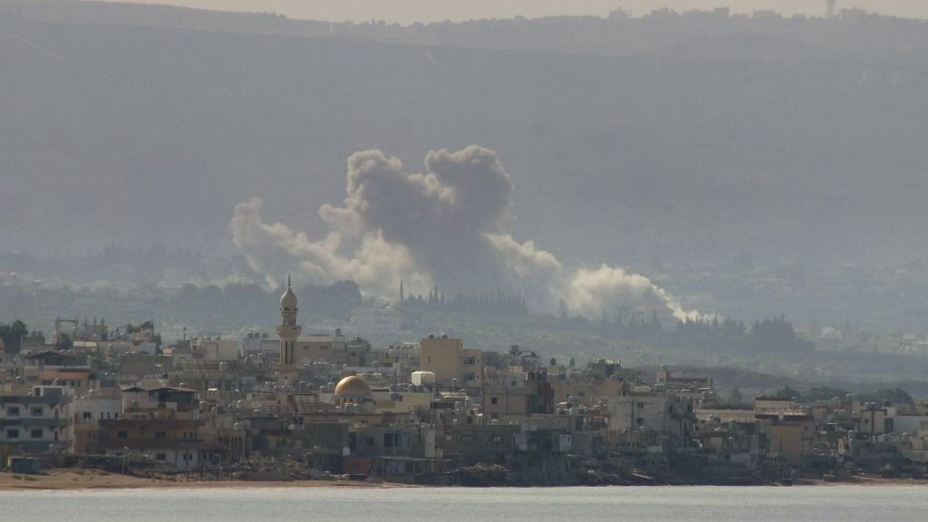 This picture taken from the southern Lebanese city of Tyre shows smoke billowing after an Israeli airstrike that targeted the southern Lebanese village of Qlaileh, on October 14, 2024, amid the ongoing war between Israel and Hezbollah. (Photo by Kawnat HAJU / AFP)