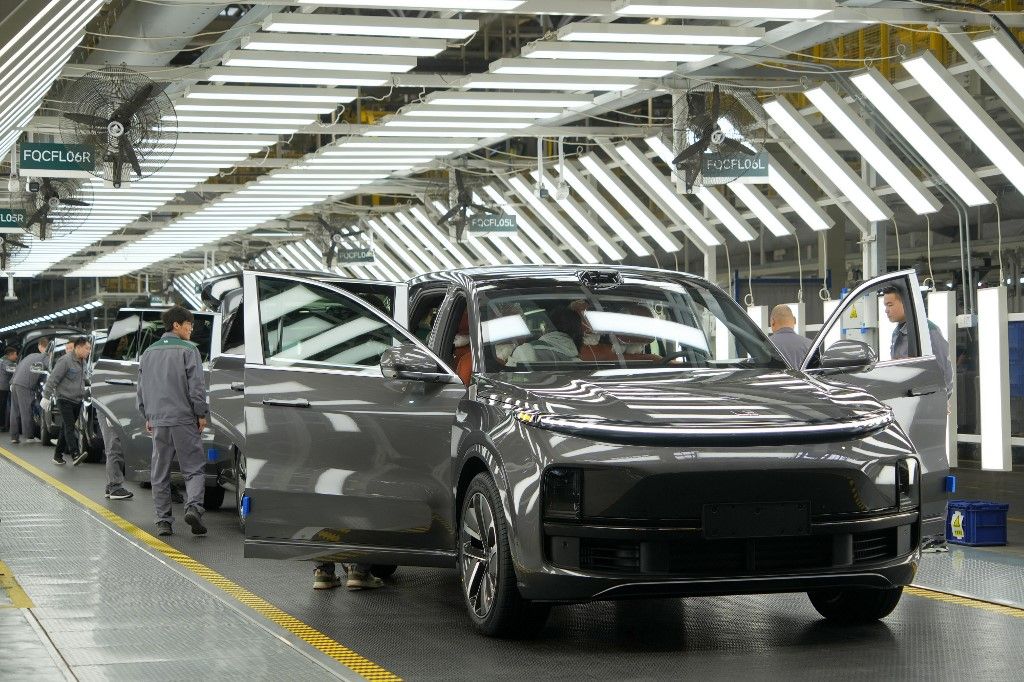 Chinese New Energy Vehicle Manufacturing
A worker is assembling auto parts on a production line at the Li Auto Manufacturing base in Changzhou, Jiangsu Province, China, on March 27, 2024. Over the past decade, China's annual sales of new energy vehicles have risen from 75,000 to 9.5 million, making up more than 60% of the global total, with a compound annual growth rate of 71%. (Photo by Costfoto/NurPhoto) (Photo by CFOTO / NurPhoto / NurPhoto via AFP)